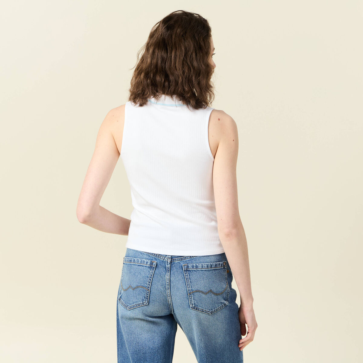 Polo sans manches blanc femme