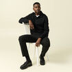 Polo cintr&eacute; manches longues en coton noir homme