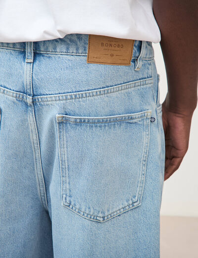 Jeans large longueur 32 en coton denim bleach homme
