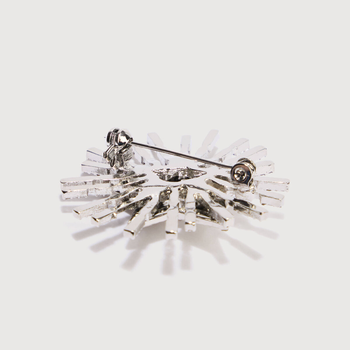 Broche avec strass couleur argent femme