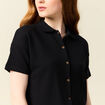 Polo en maille noir femme