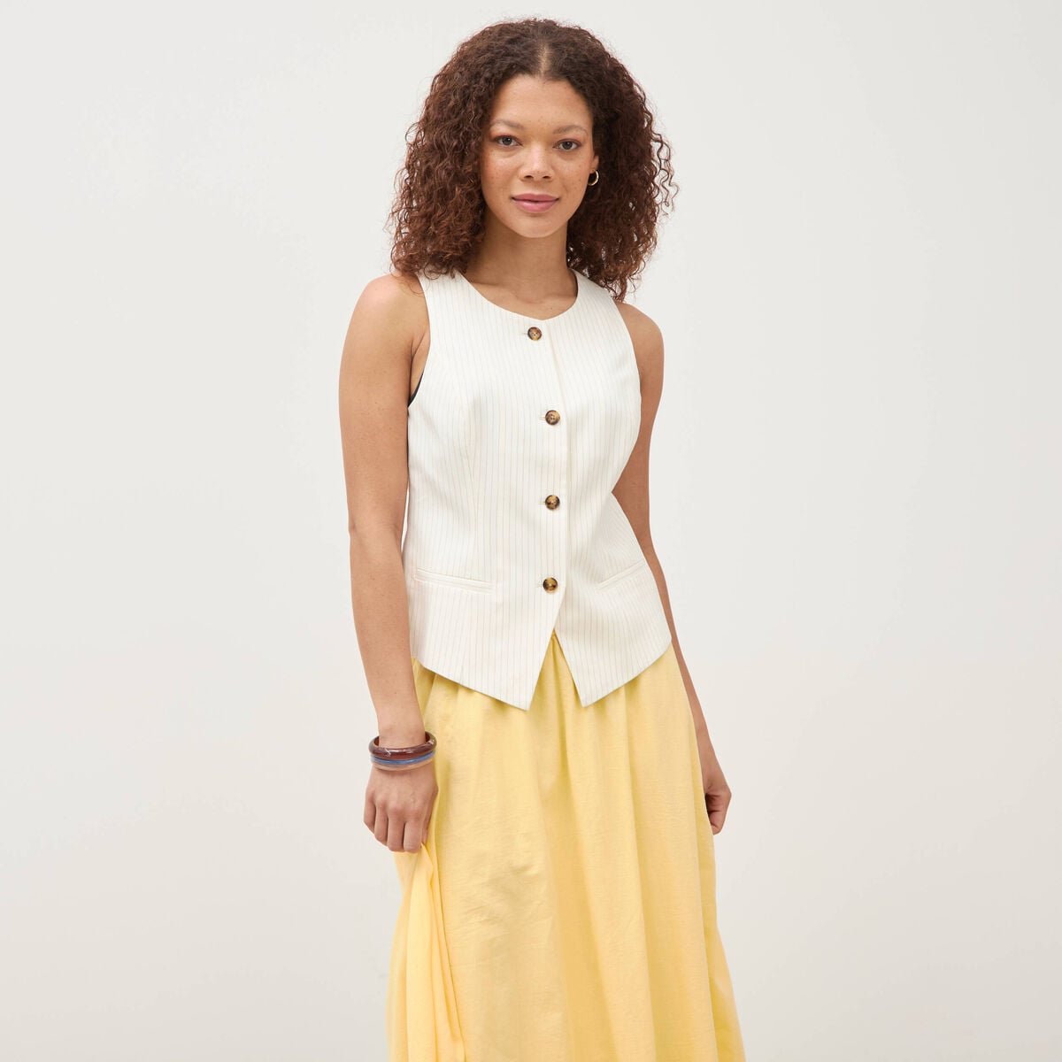 Gilet sans manches col rond doubl&eacute; ivoire femme