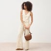 Gilet ajust&eacute; court sans manches col v jaune pastel femme